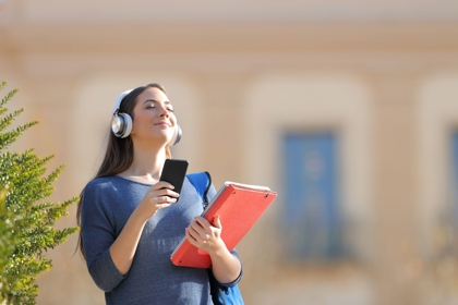 Happy Student Breathing Fresh Air Listening To Music